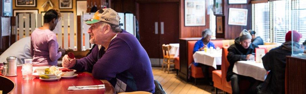 A man eats at the bar of Junior's restaurant, a staple of Brooklyn dining since the 1950s, on February 21, 2014