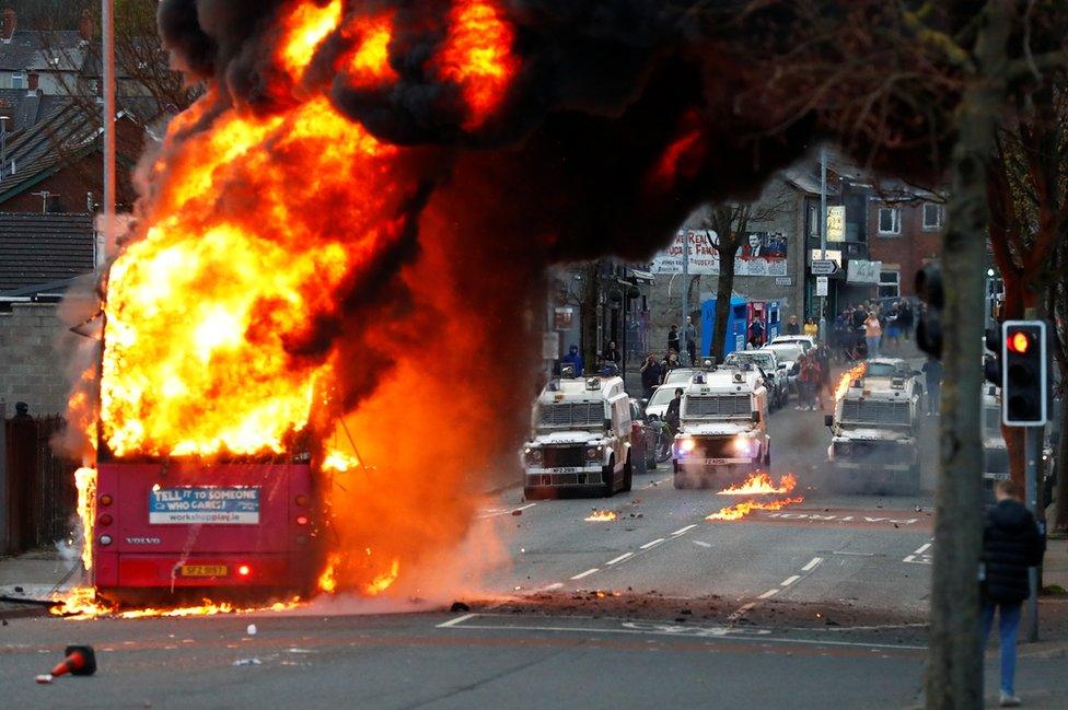 A bus burns on a street in west Belfast on 7 April