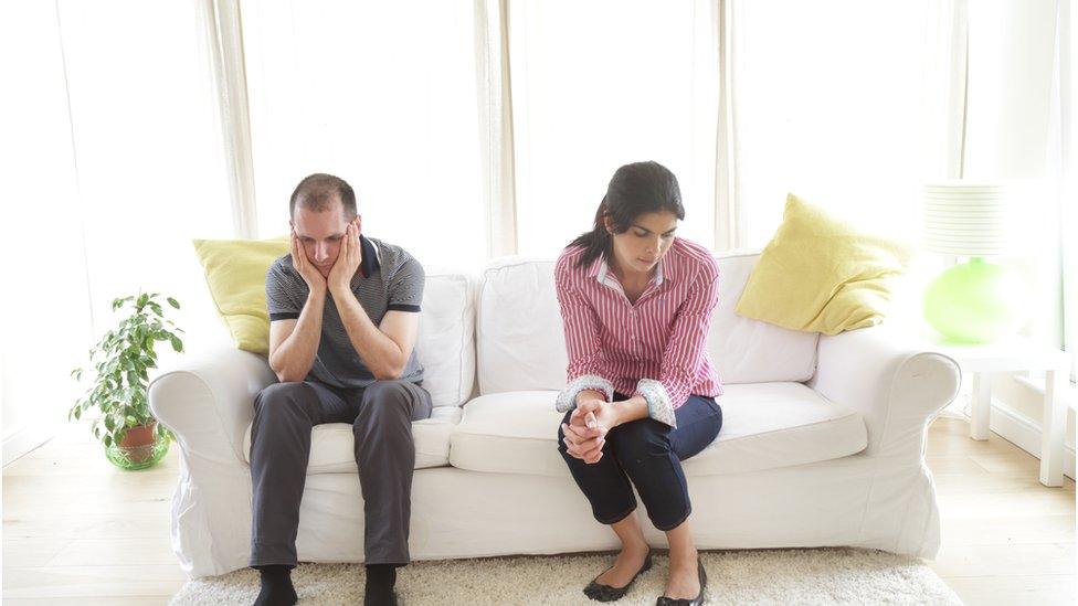 Couple sitting on a sofa