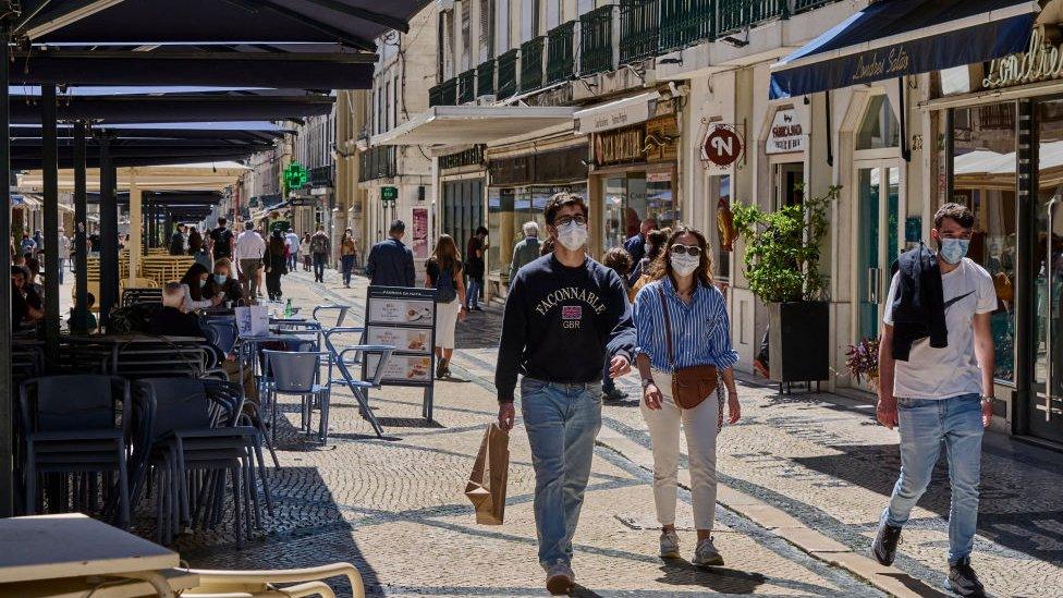 People on the street in Lisbon.