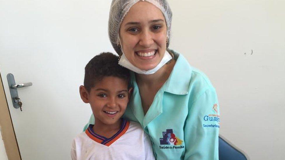 Dentist Amanda Mattos and Ryan smiling after he received his denture