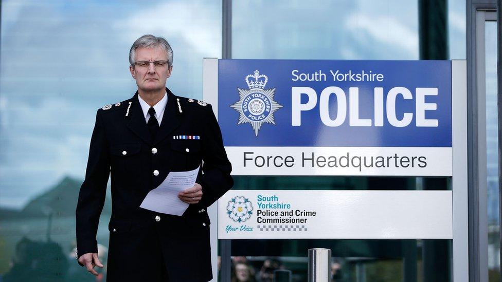 David Crompton walking out to address the gathered media.