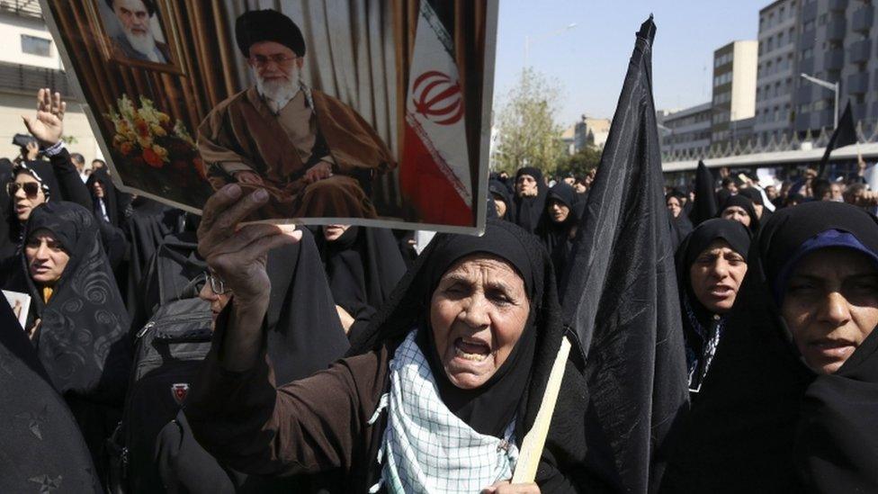 Iranian woman carries poster of Ayatollah Ali Khamenei at anti-Saudi rally in Tehran - 25 September