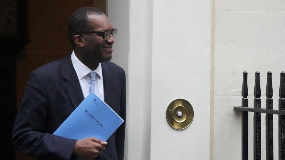 Chancellor Kwasi Kwarteng walks outside Downing Street in London