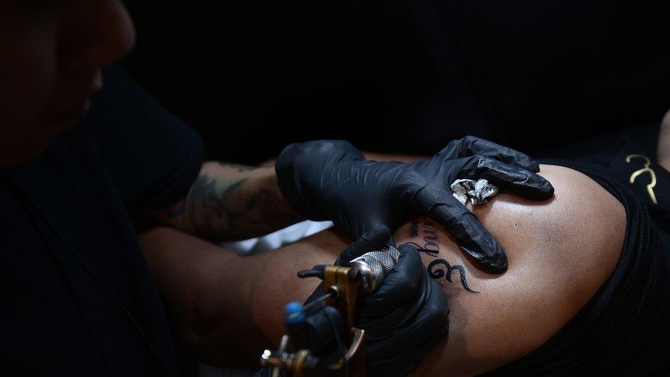 A tattooist at work