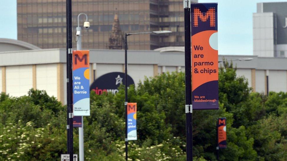 A banner saying 'we are parmo and chips'