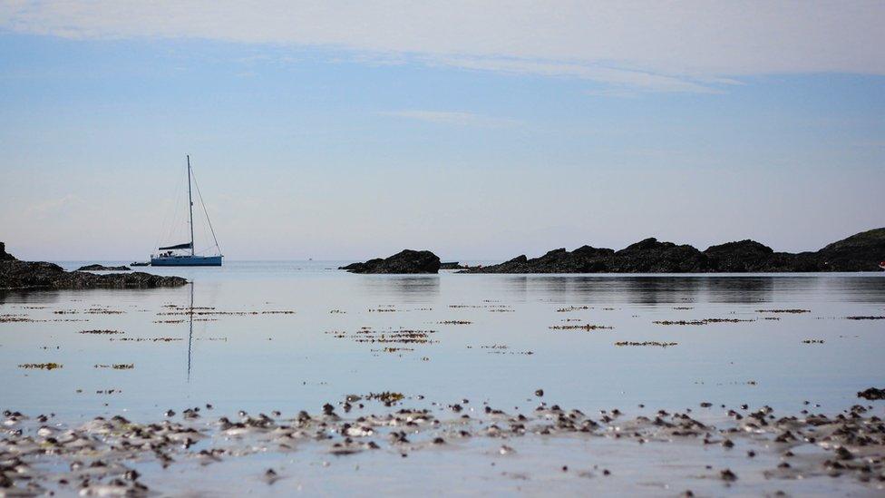 A boat sailing at Borth Wen on Anglesey, captured by Clare Harding-Lyle