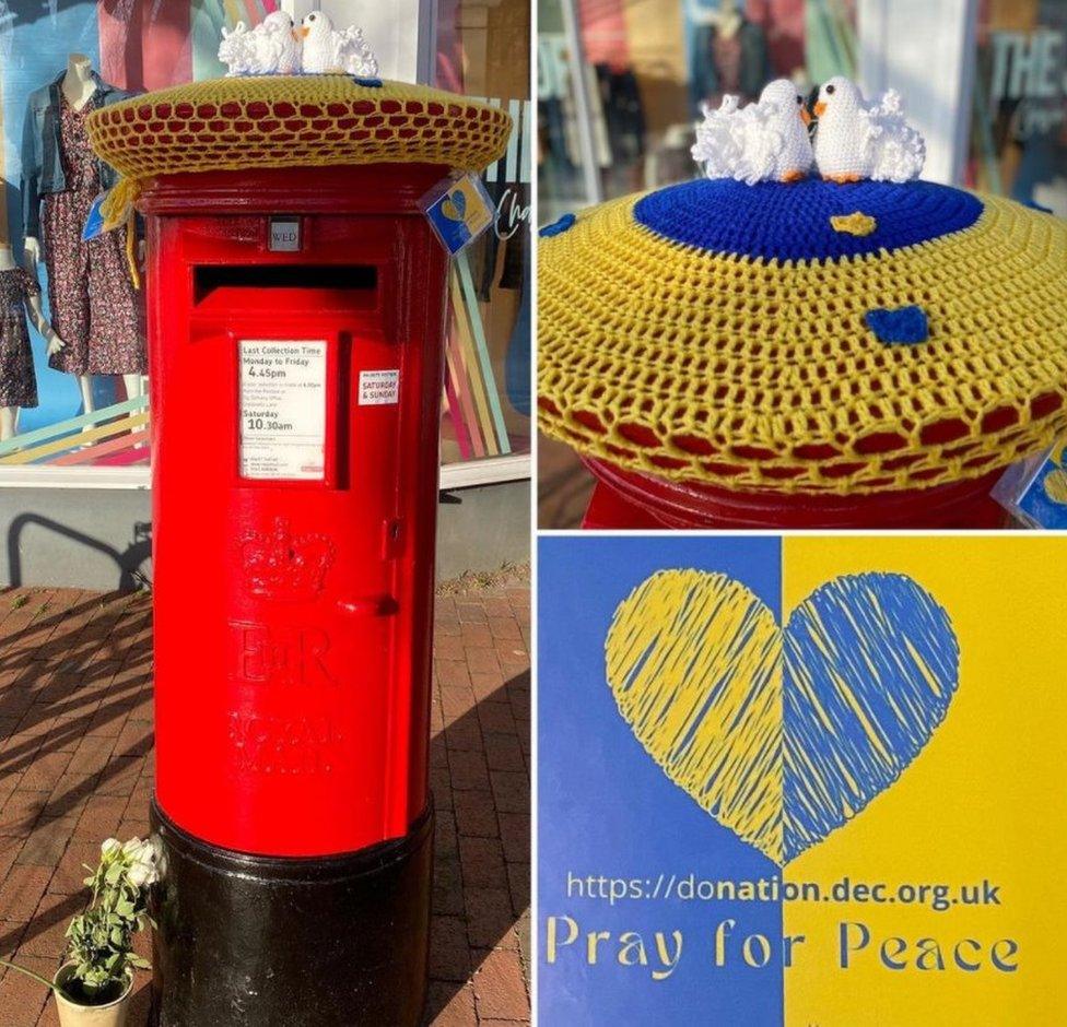 Photos showing yarn-bombed postbox in Ely