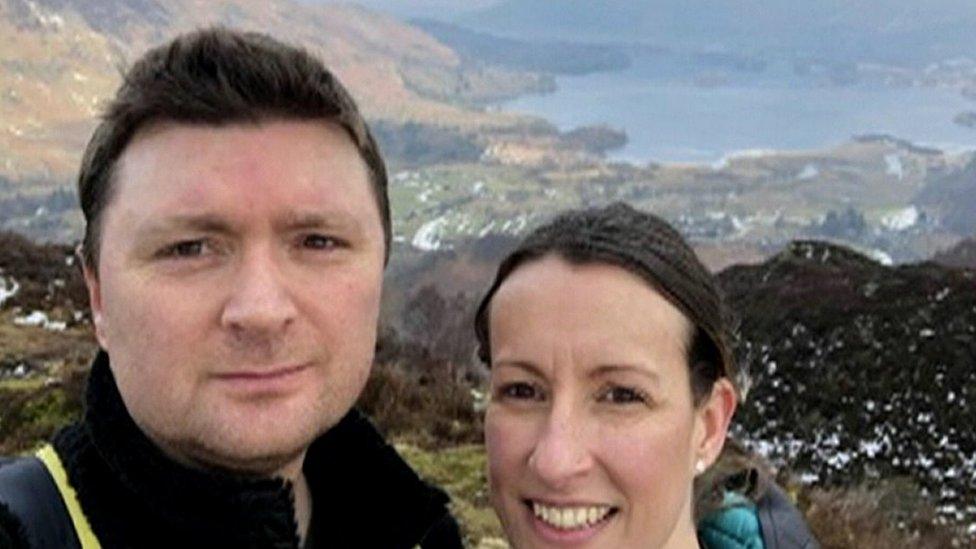 Stephen Hocking and his wife take a selfie on a mountain