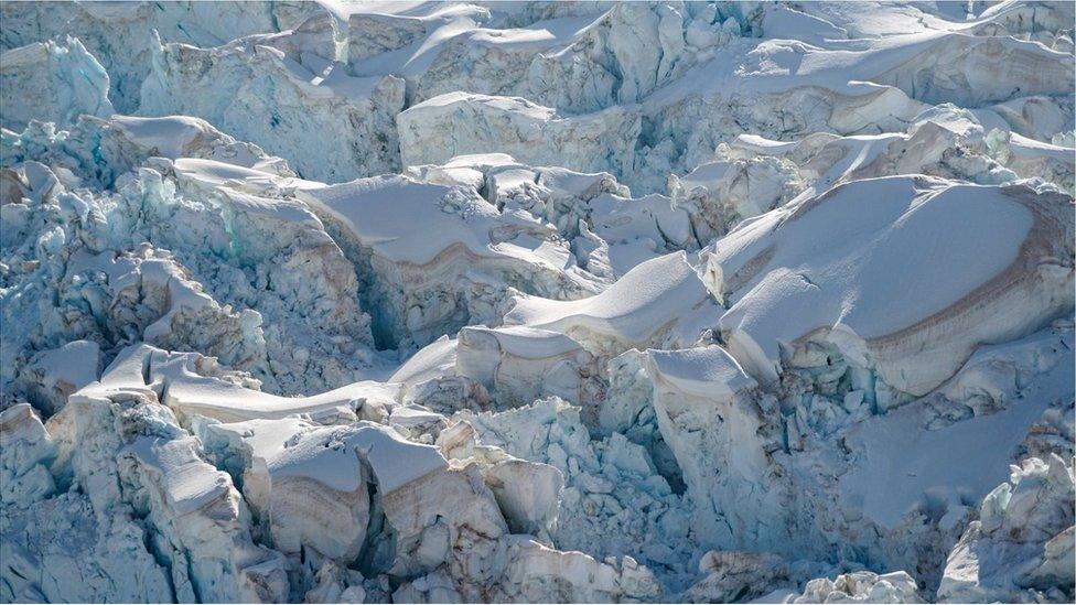 Glacial snow with layers of red dust