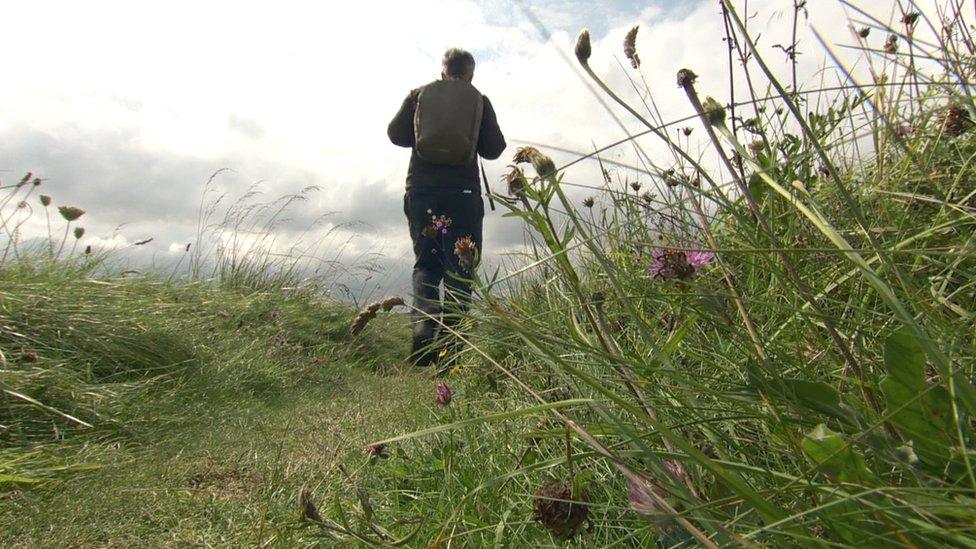 Walker on coastal path