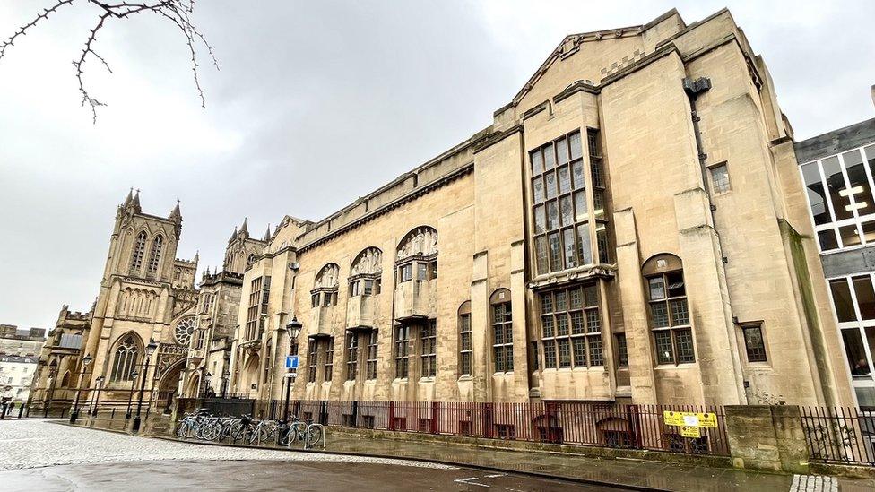 An exterior shot of Bristol Central Library with the city's cathedral in the background