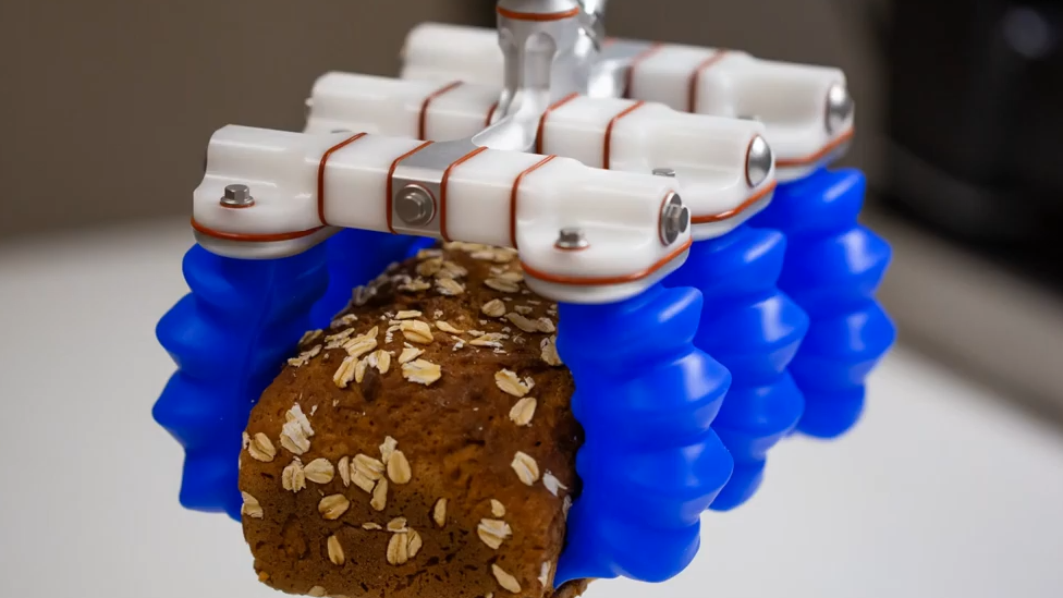 Soft Robotics gripper holding cake