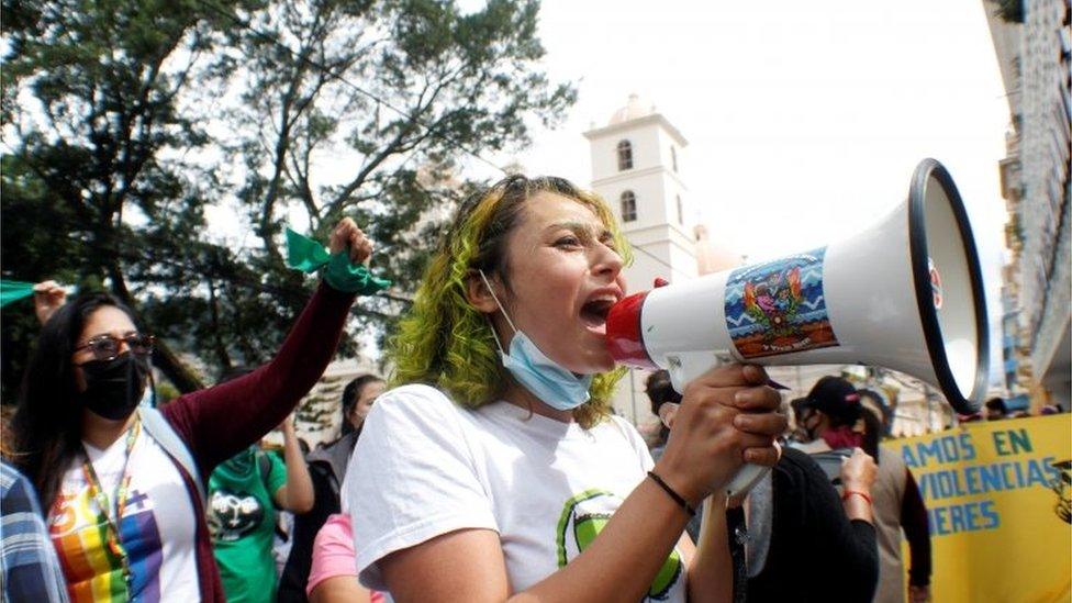 A woman speaks through a megaphone during a demonstration in favour of legalising abortion, after lawmakers approved a constitutional reform that would reinforce the ban, near the Congress in Tegucigalpa, Honduras January 25, 2021.