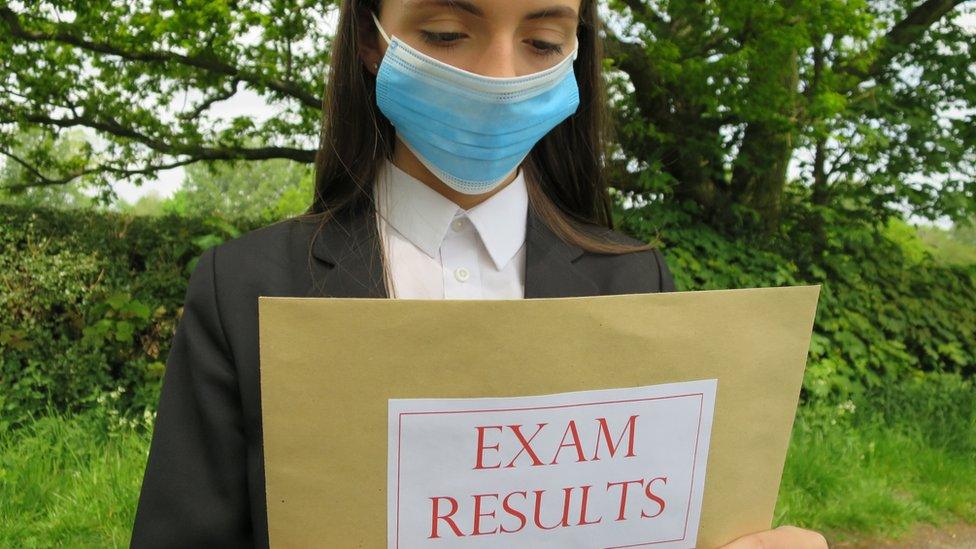 girl-holds-exam-results