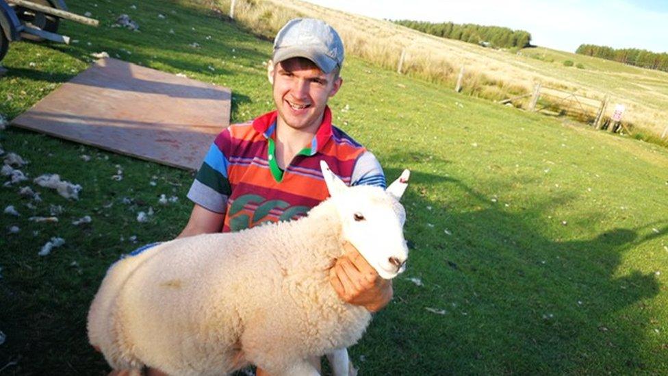 Lewis Davies with a sheep