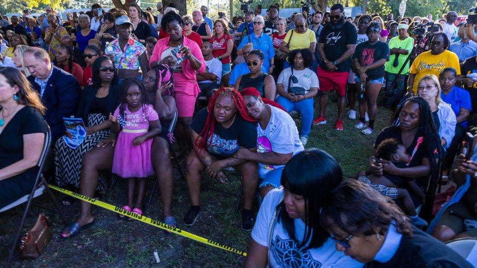 Mourners pay tribute to the victims