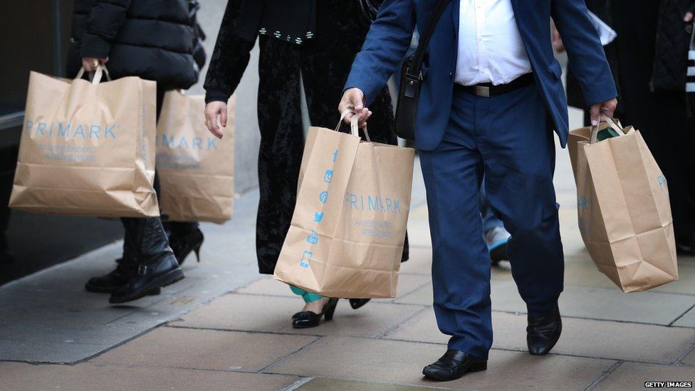 People carrying Primark shopping bags