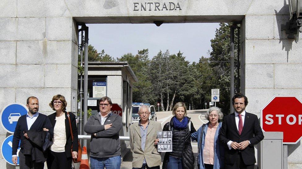 Relatives of the men exhumed at Valley of the Fallen) stand outside the site at San Lorenzo del Escorial in Madrid, Spain on 23 April 2018.