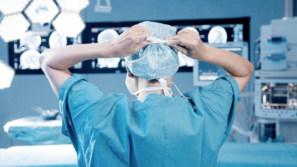 Surgeon in operating theatre