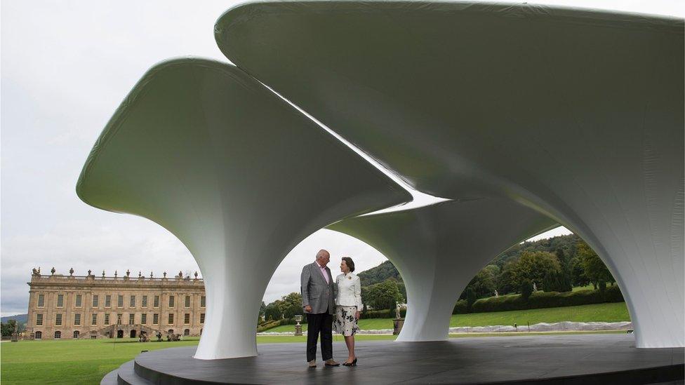 The Duke and Duchess of Devonshire view Lilas, by artist Zaha Hadid, one of the many monumental sculptures on display at Chatsworth stately home as part of the Sotheby's Beyond Limits Monumental Outdoor Sculpture Show