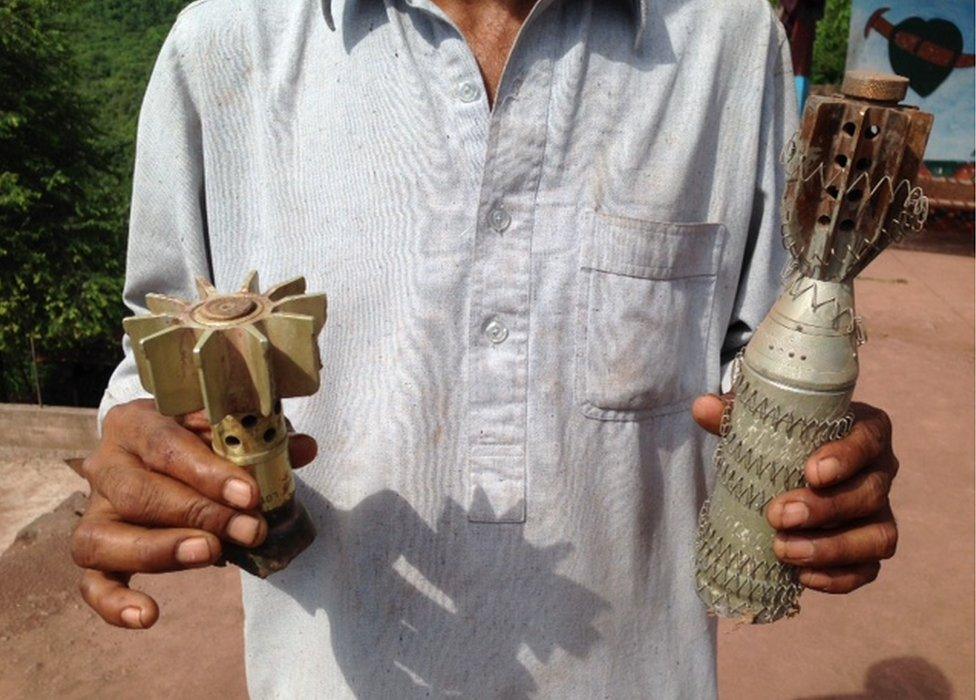 Javed Ahmed shows the BBC mortar shells and ammunition he collected in Pakistan administered Kashmir, August 2015