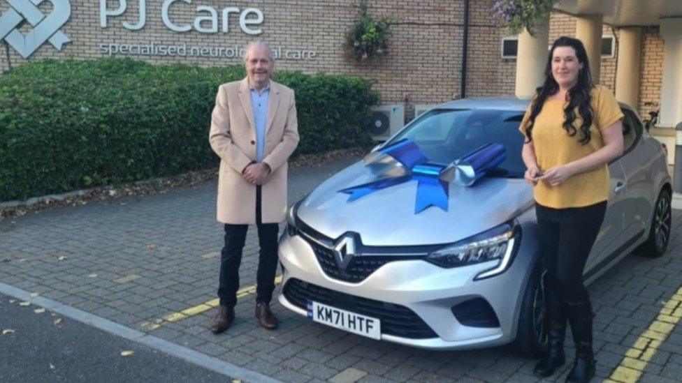 Emma Hack with her car