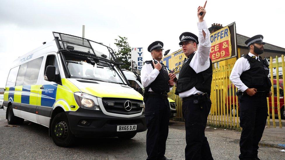 Police officers outside a property in Newham