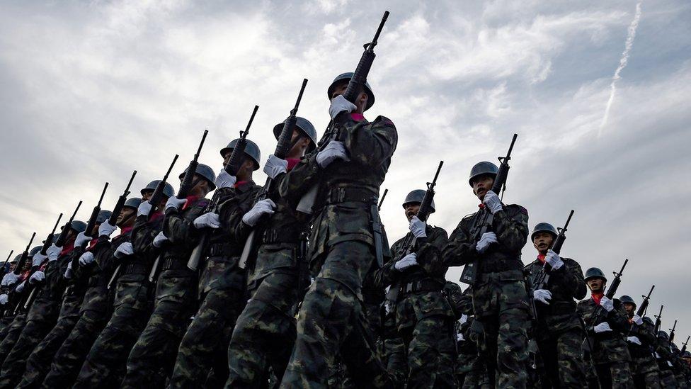 Thai soldiers marching in a parade