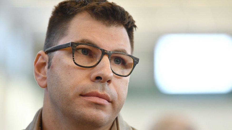 Valentino Talluto, an Italian HIV-positive man accused of infecting through unprotected sex about 30 women, looks on during his trial on October 25, 2017 in the courtroom of the Rebibbia prison