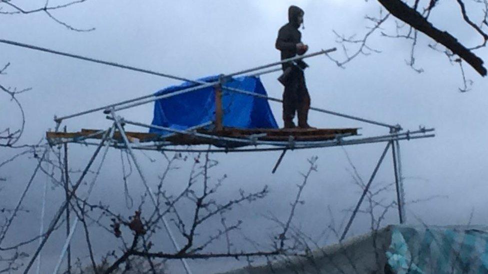 Protester in a scaffold tower