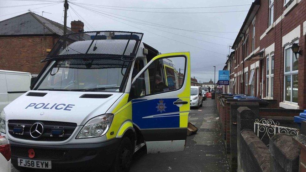 Police van at the raids