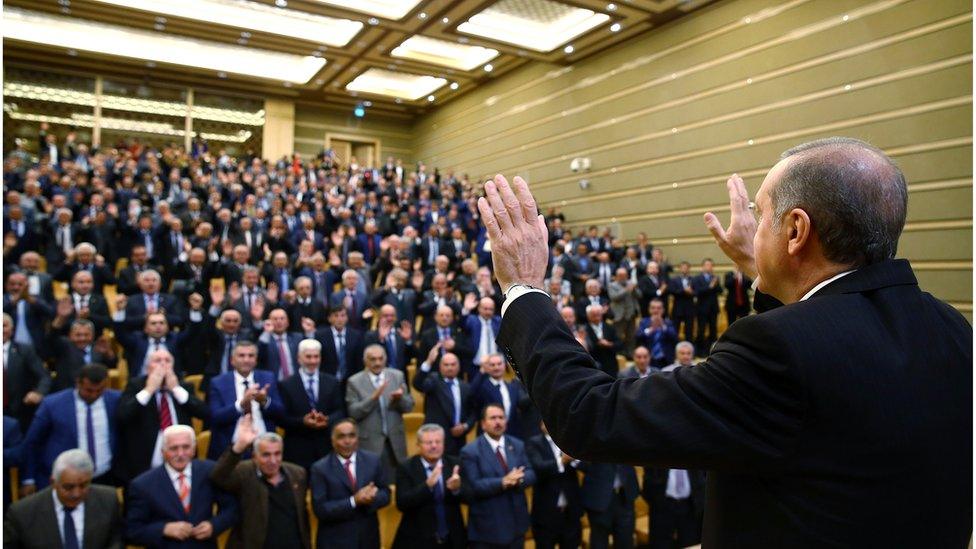 Turkish President Recep Tayyip addresses the heads of villages at his palace in Ankara