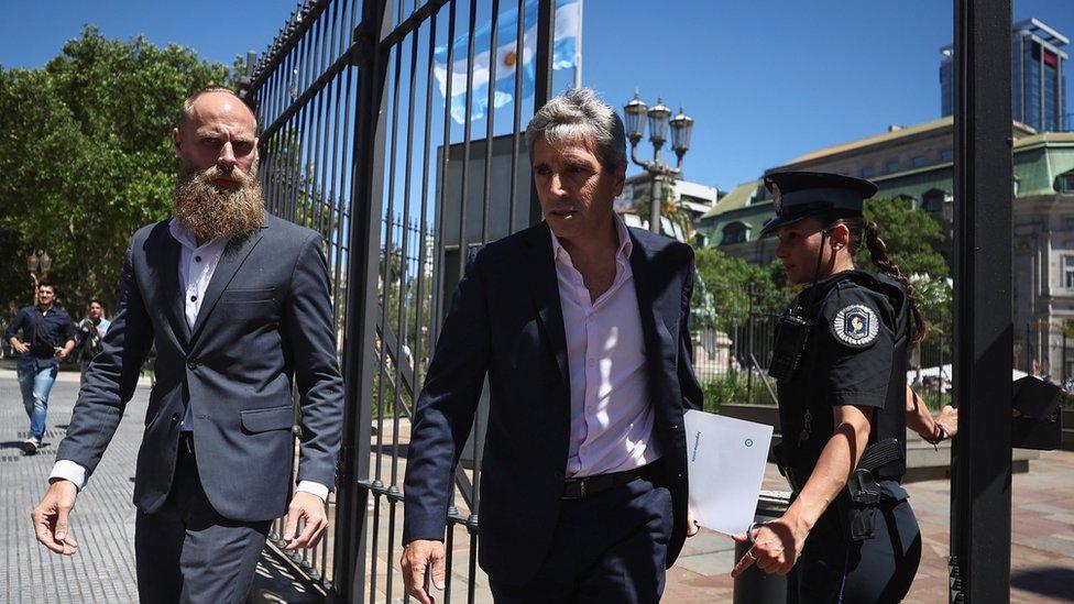 Economy Minister Luis Caputo (centre) leaves the Casa Rosada Presidential Palace one day after the inauguration of Argentina's President Javier Milei, in Buenos Aires, Argentina December 11, 2023.