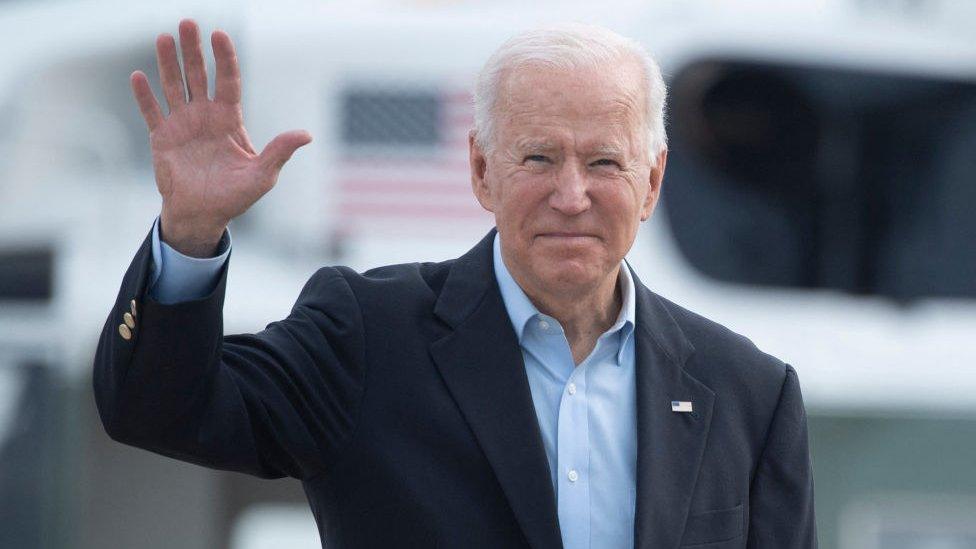 Biden waves