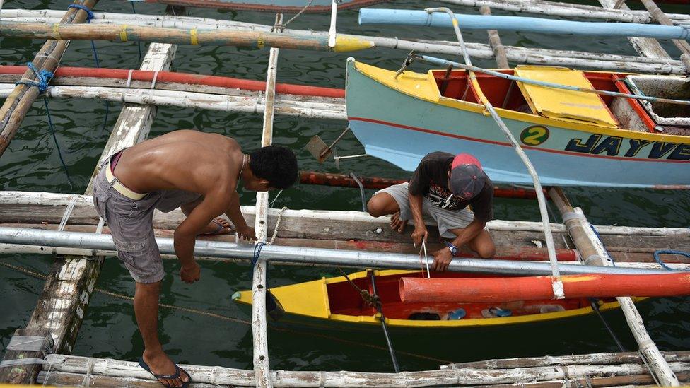 Filipino fishermen prepare and resupply their boat for another fishing trip to the Spratlys, on 10 July, 2016 in Mariveles, Bataan, Philippines.