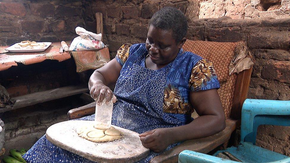 Joyce Namugalu Mutasiga pressing out pancakes from pastry