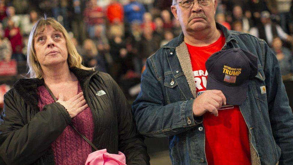 Trump supporters stand for the national anthem before the start of the "USA Thank You" tour event with President-elect Donald Trump and Vice President-elect Mike Pence, Thursday, Dec 1, 2016 in Cincinnati