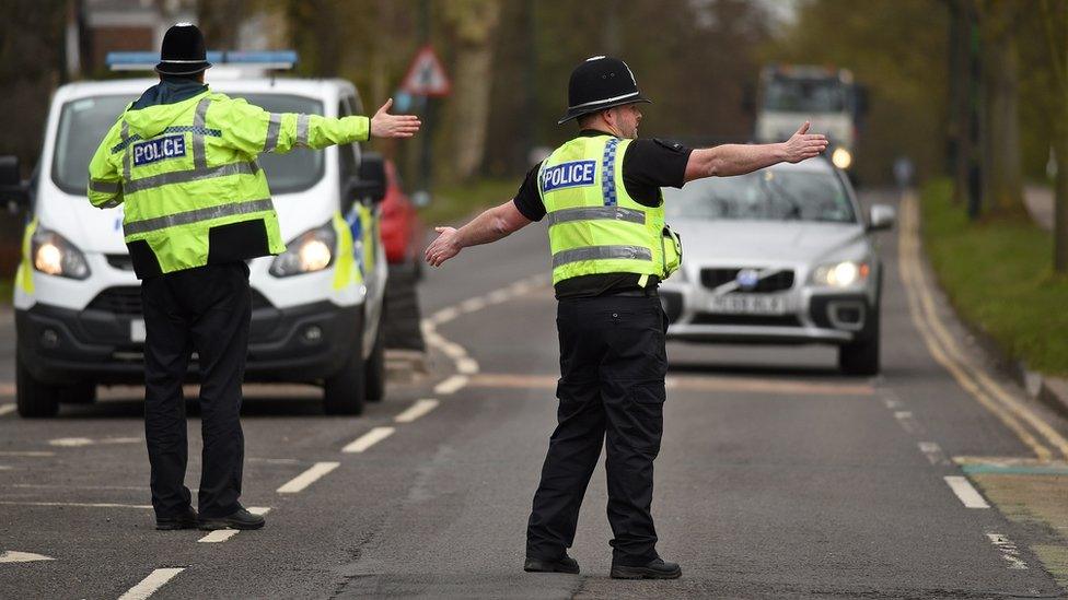 Police officers from North Yorkshire Police stop motorists in cars to check that their travel is "essential"