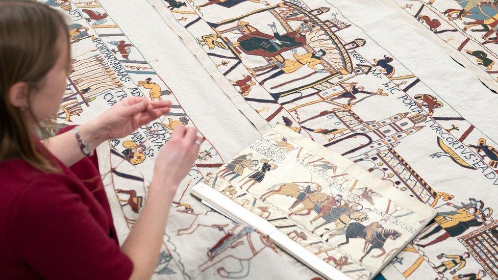 Mia Hansson with her unfinished recreation of the Bayeux Tapestry