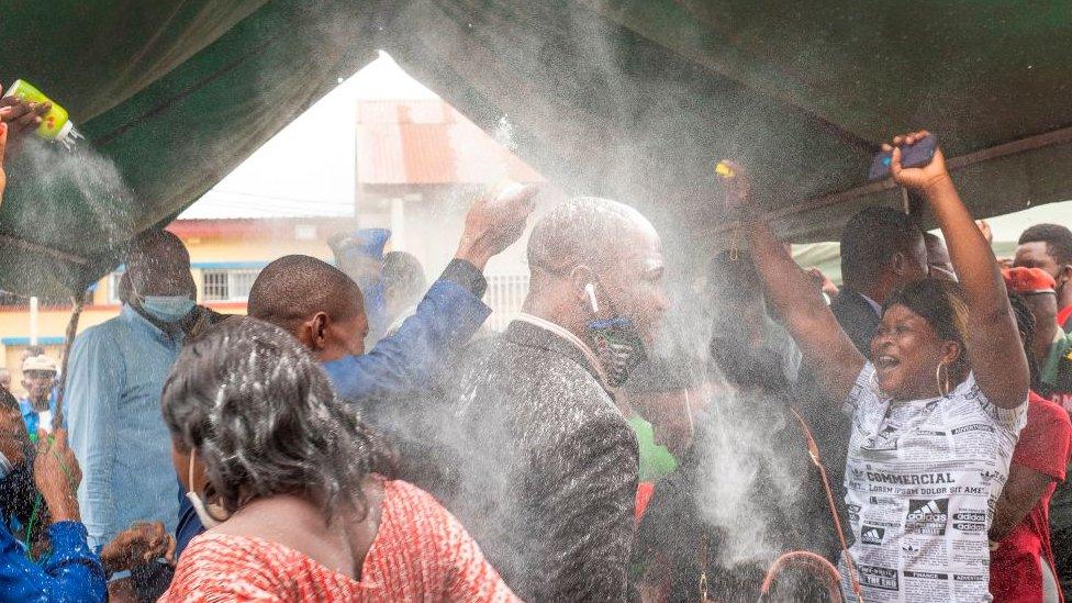 Family members celebrate with pardoned prisoners at the Makala Prison in Kinshasa, Democratic Republic of Congo