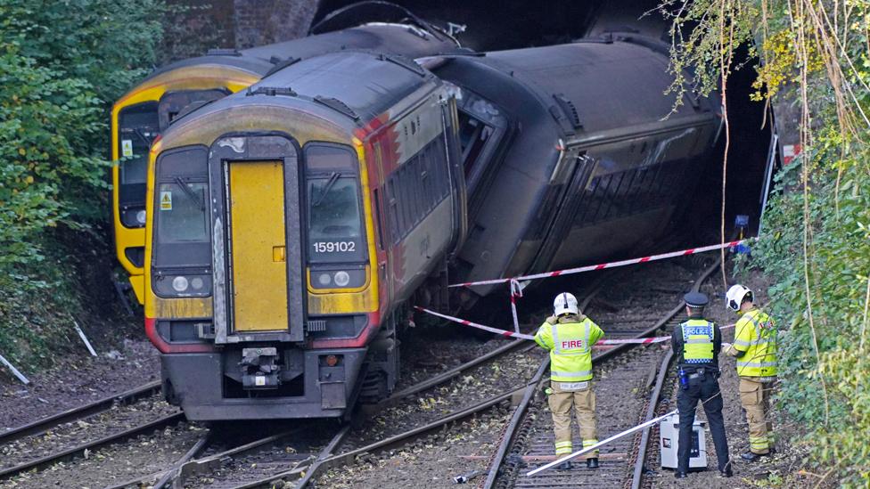 Police and firefighters at the scene of a crash involving two trains near the Fisherton Tunnel between Andover and Salisbury in Wiltshire on 1 November 2021