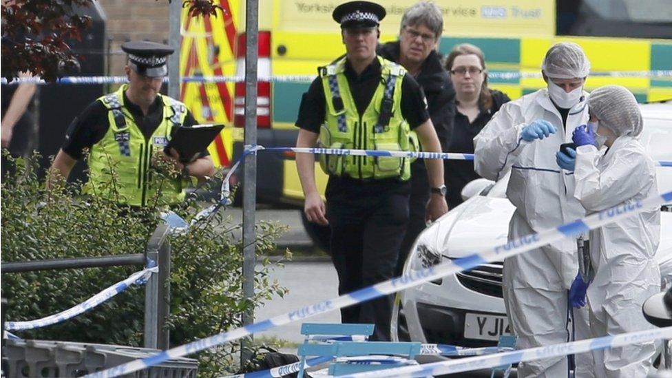 Police officers at the scene in Birstall