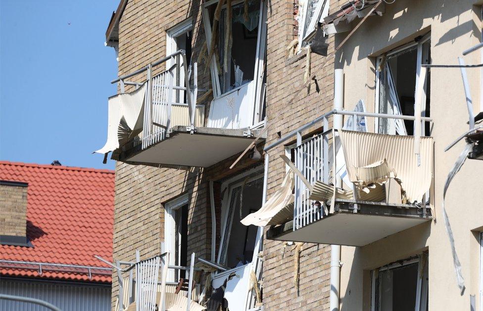 Damaged balconies and windows are seen at a block of flats that were hit by an explosion Friday morning, June 7, 2019