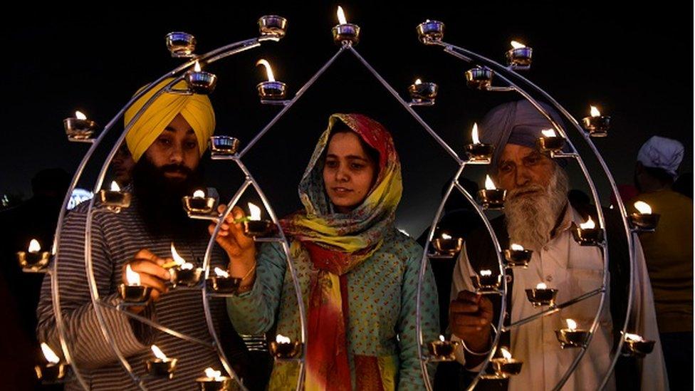 Sikh devotees light candles on the occasion of Bandi Chhor Divas