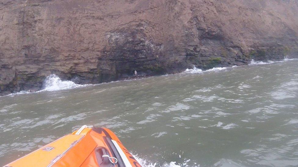 The rescue showing the man and woman at the cave