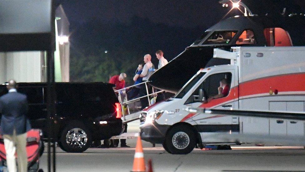 A person believed to be Otto Warmbier is transferred from a medical transport airplane to an awaiting ambulance at Lunken Airport in Cincinnati, Ohio, U.S., June 13, 201