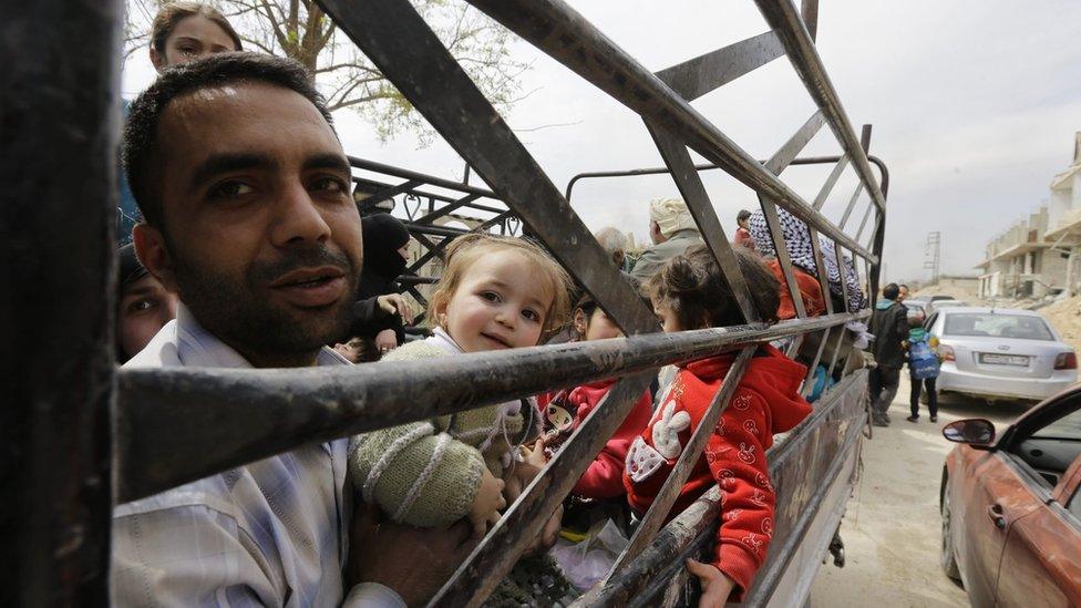 People leave the besieged, rebel-held Eastern Ghouta on 15 March 2018