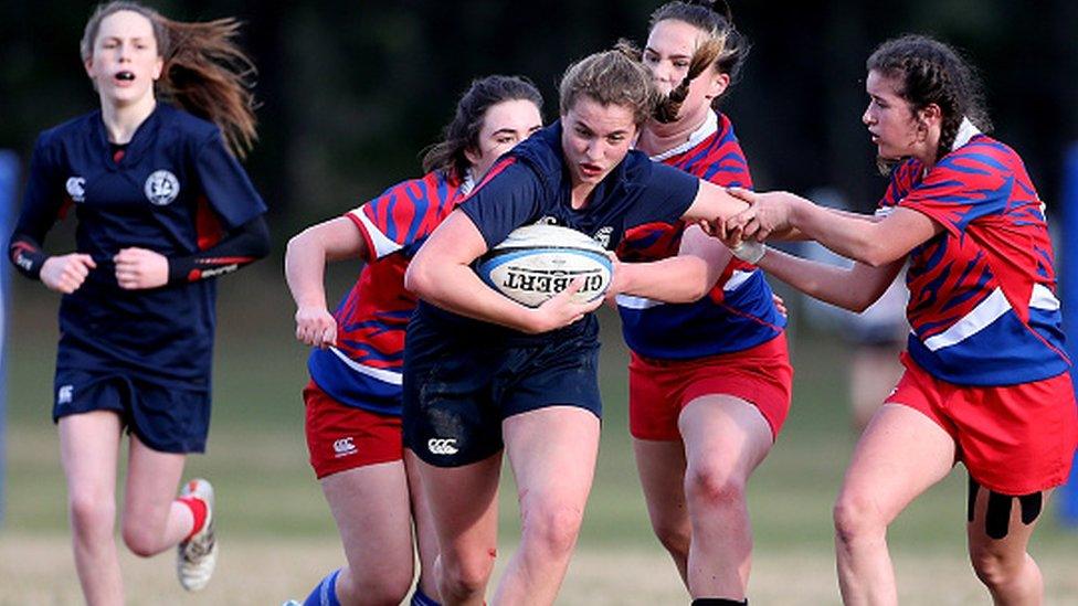 Generic girls playing rugby