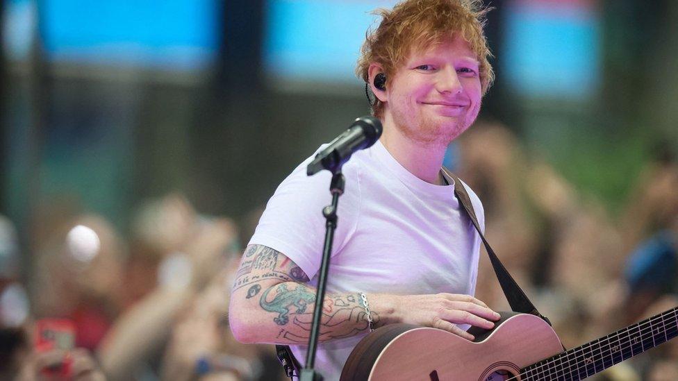 Musician Ed Sheeran with a guitar